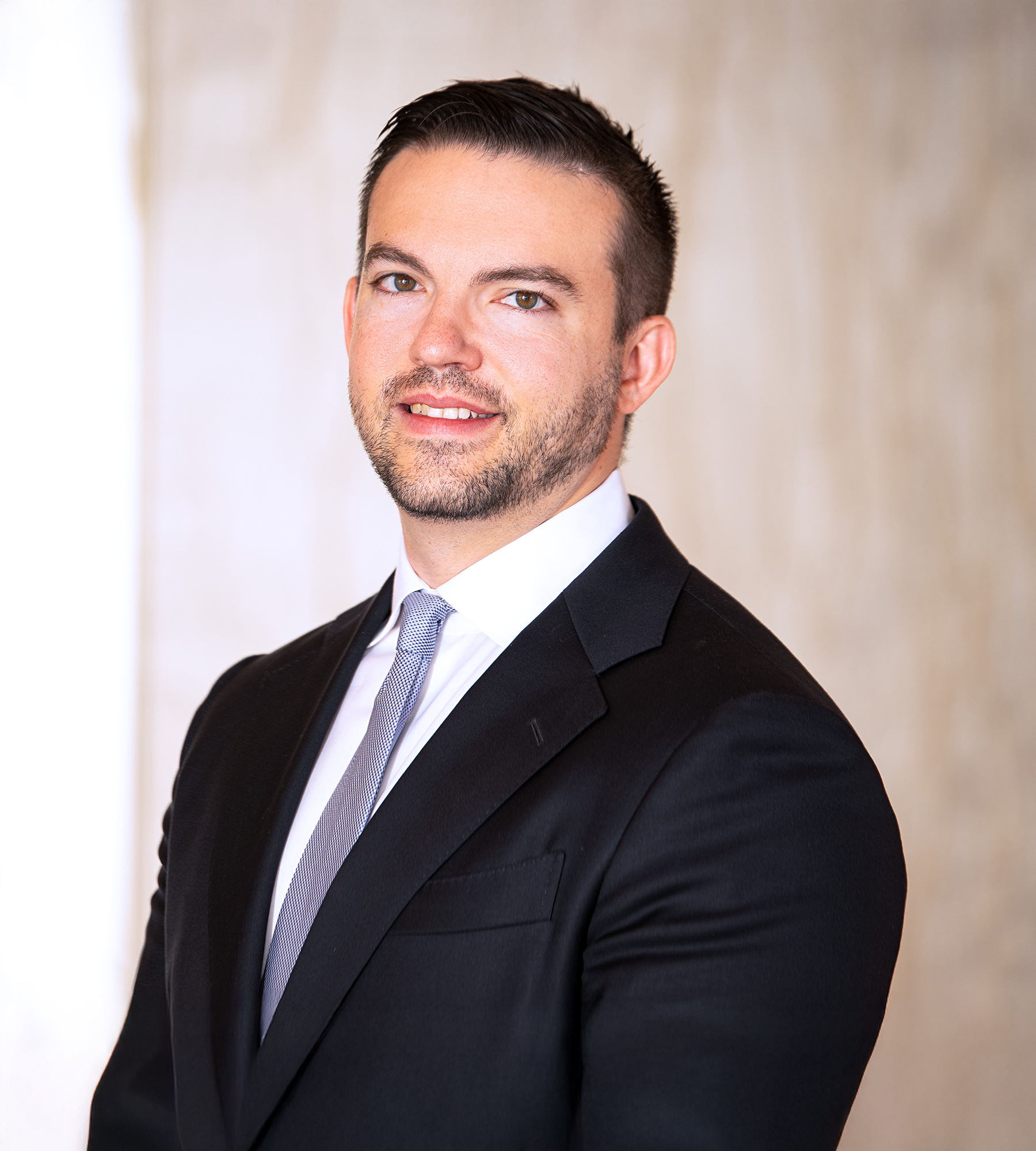 Photo of Andrew Rohrbach standing in an office