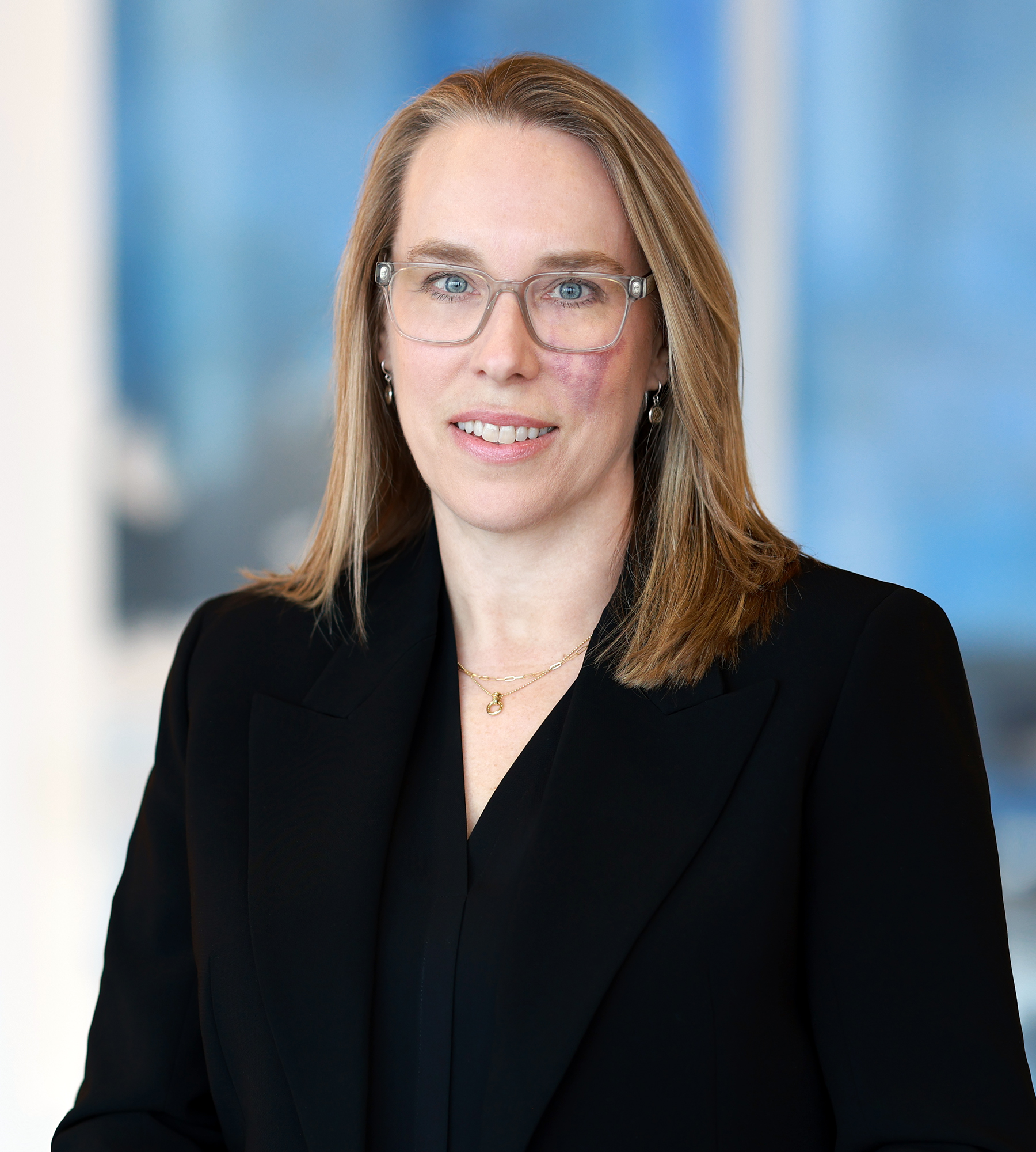 Photo of Laurel Loomis Rimon standing in an office