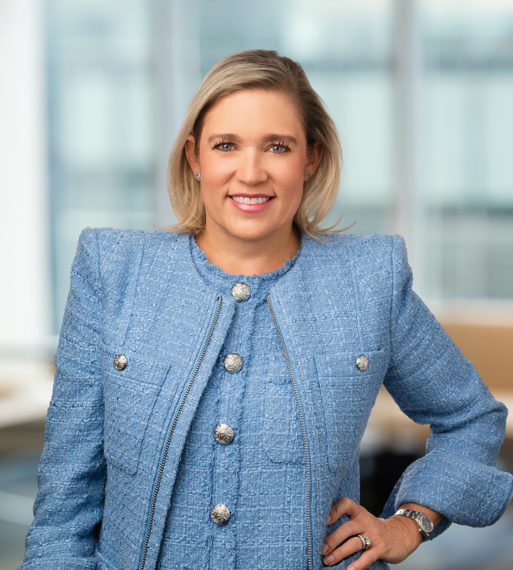 Photo of Ashley Callen standing in an office