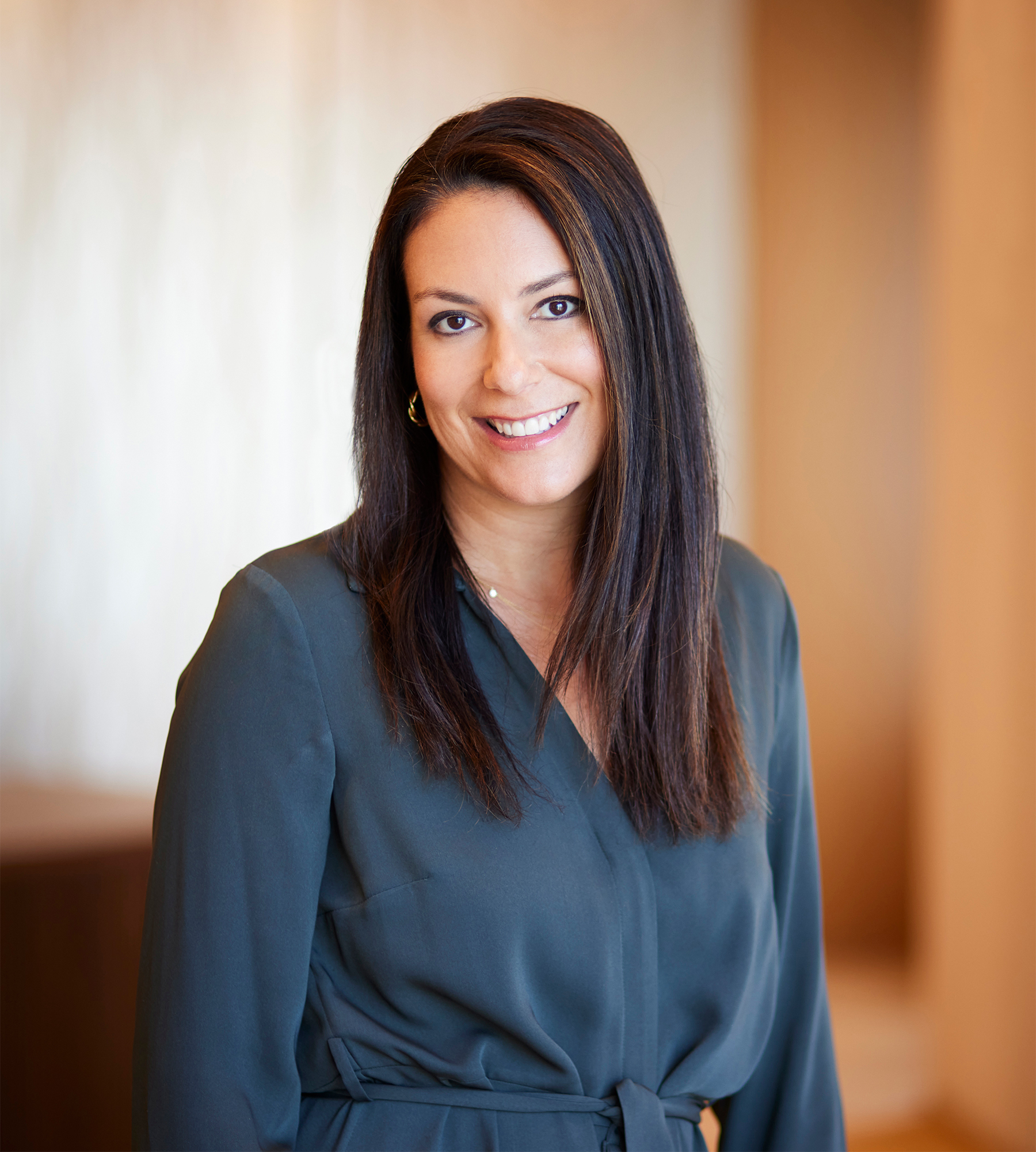 Photo of Alison Stein standing in an office