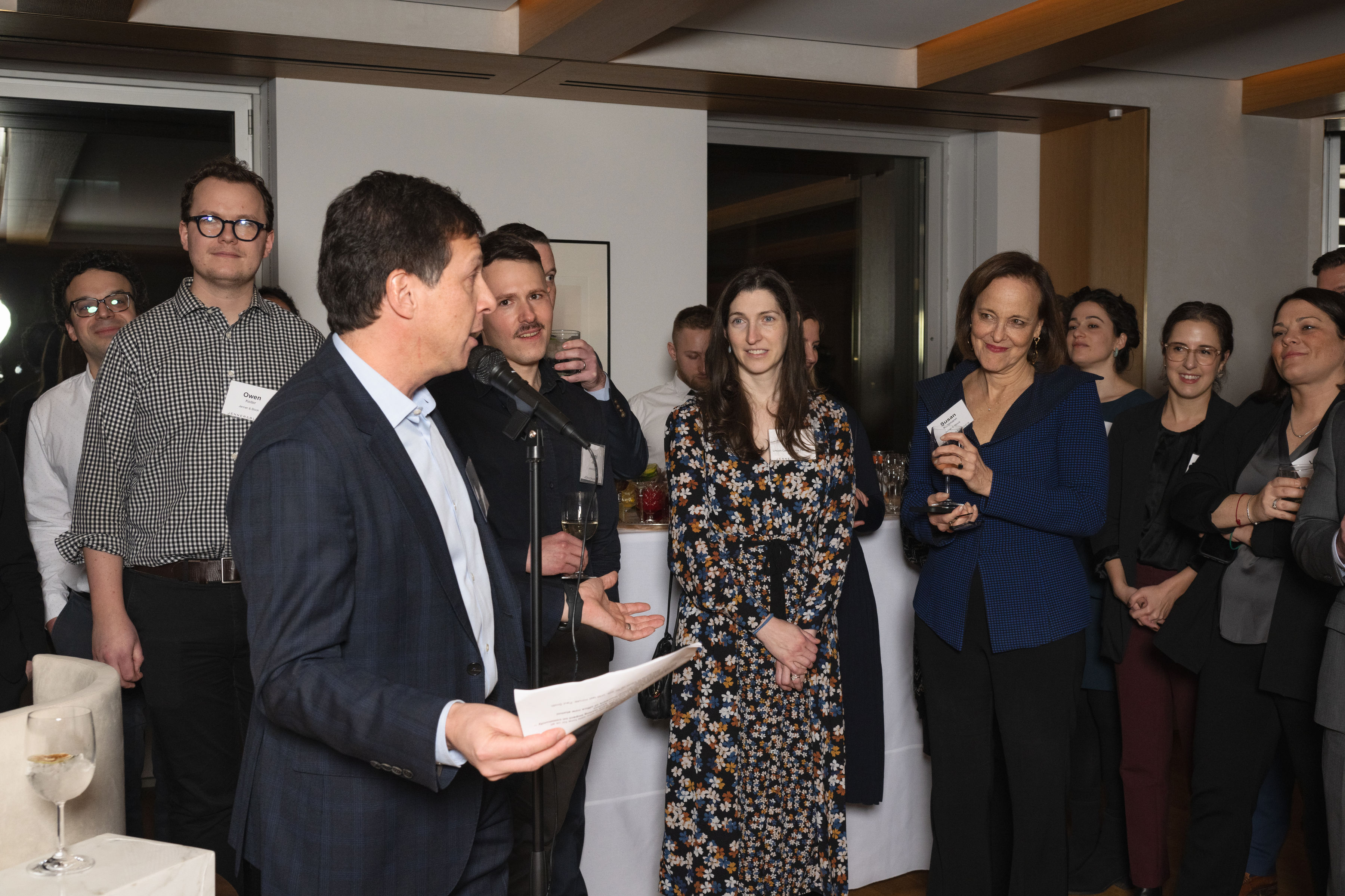 Photo of Jenner alumni gathered in our New York office for an alumni event on March 1, 2023