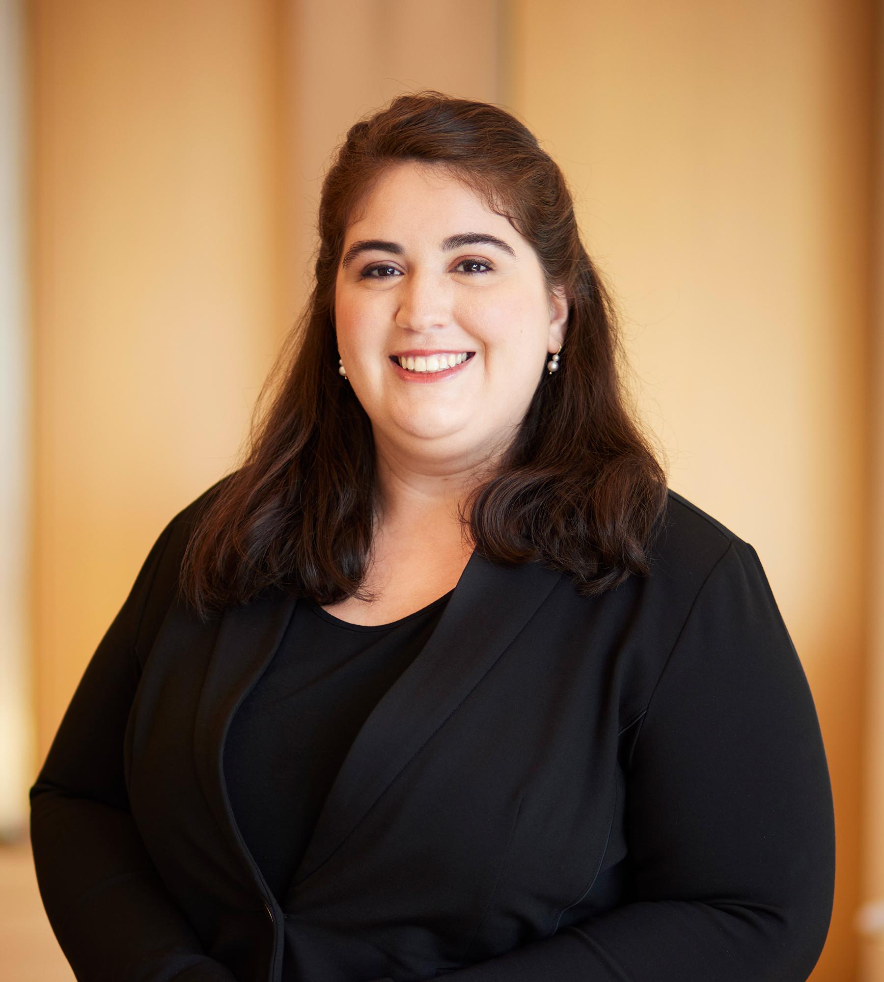 Photo of Allison Douglis standing in an office