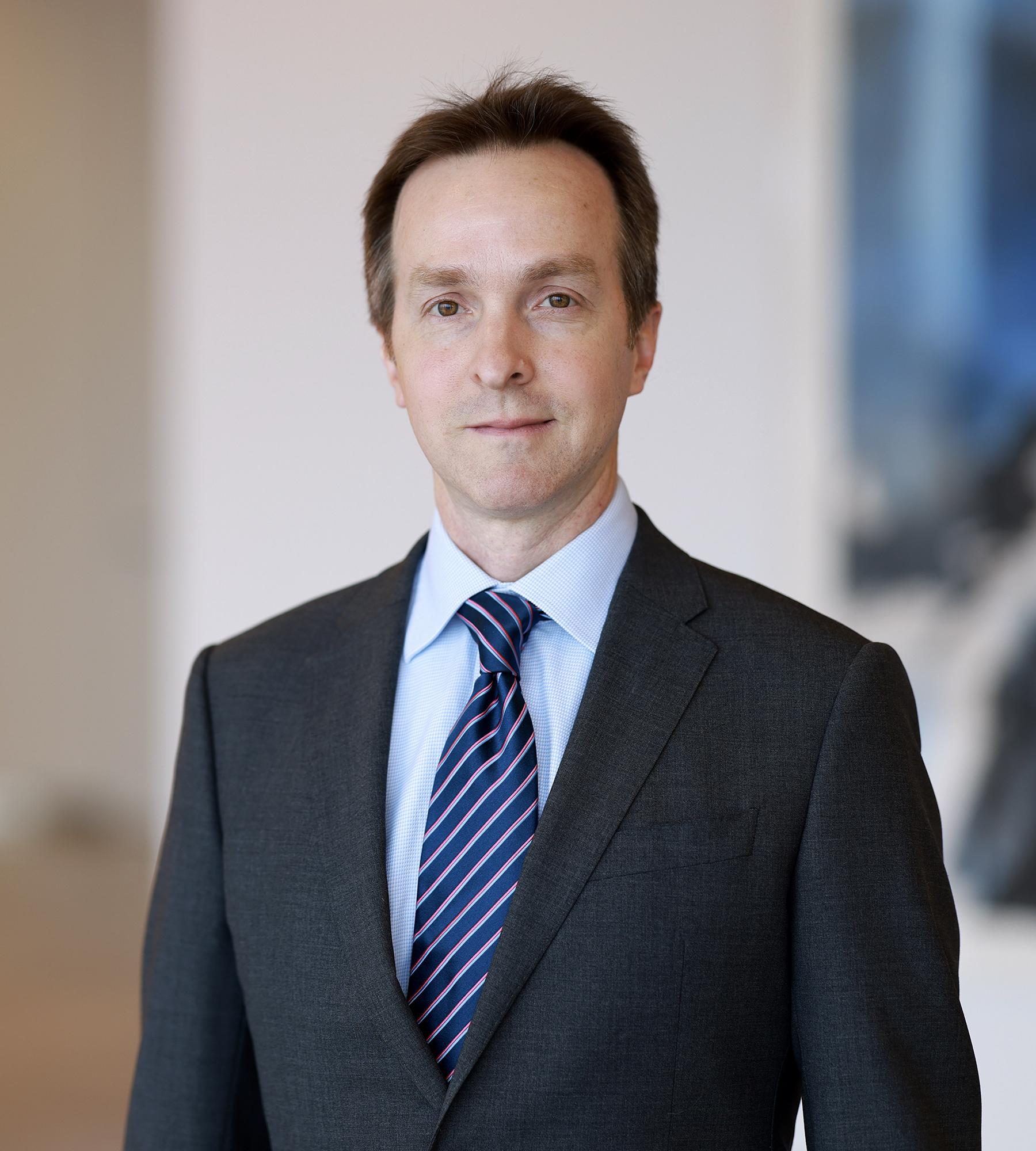 Photo of James Reiland standing in an office