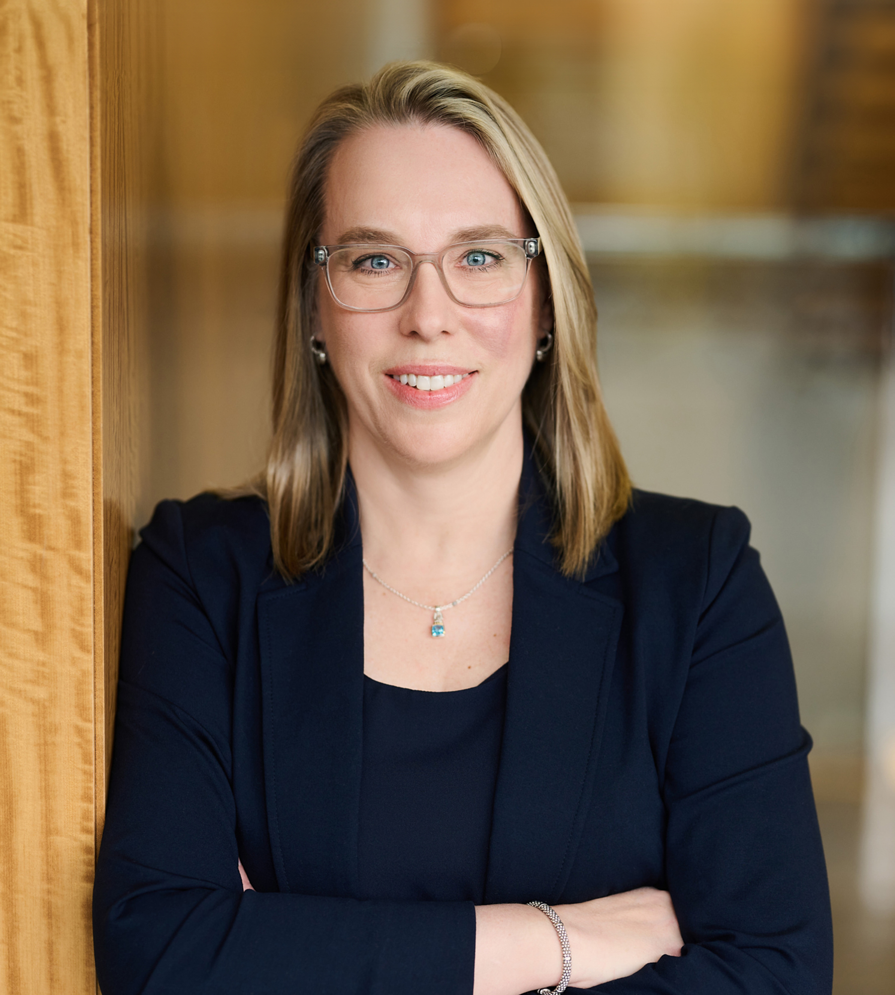 Photo of Laurel Loomis Rimon standing in an office