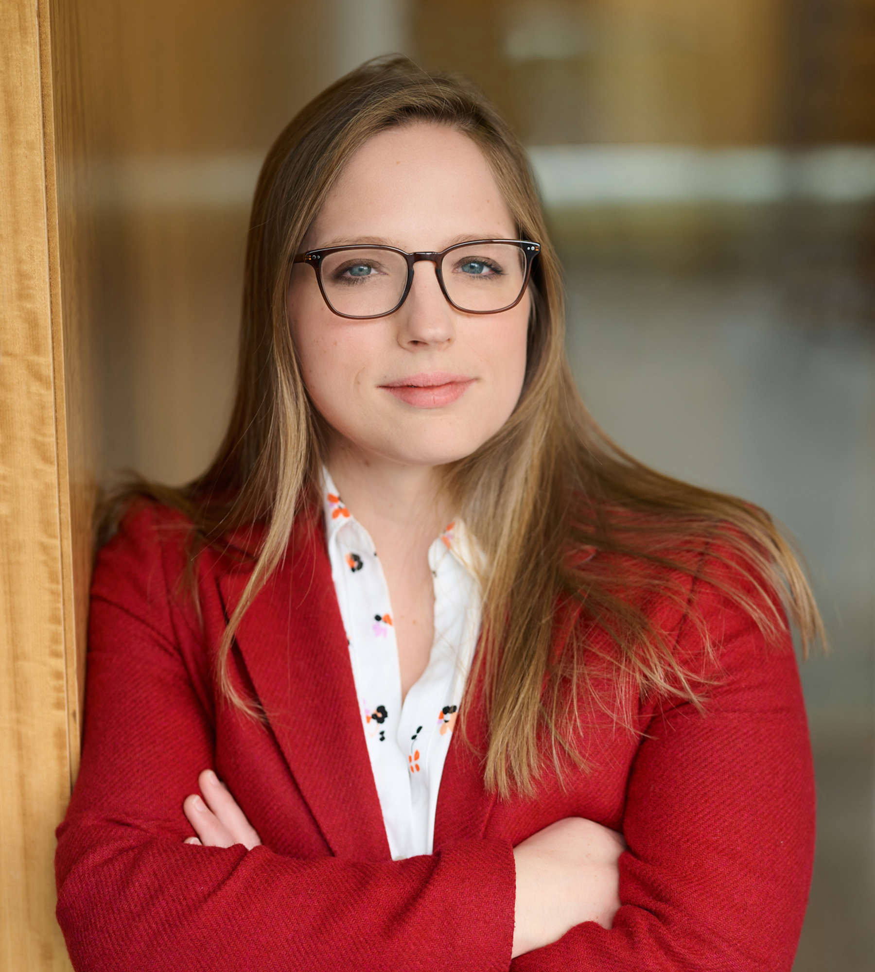 Photo of Hillary Ledwell standing in an office