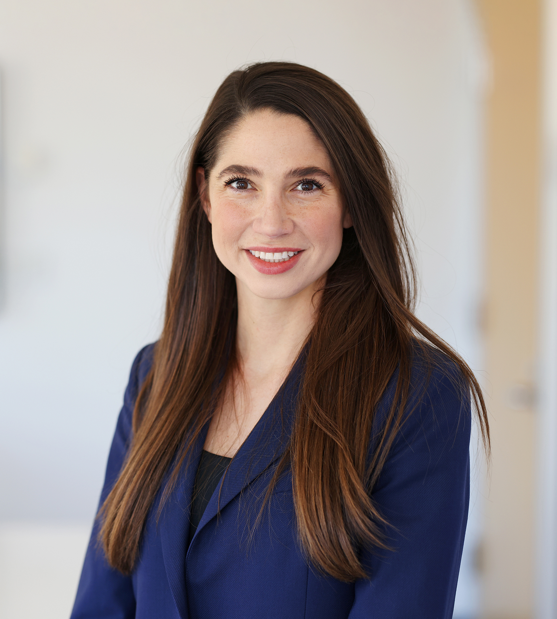 Photo of Paige Zielinski standing in an office
