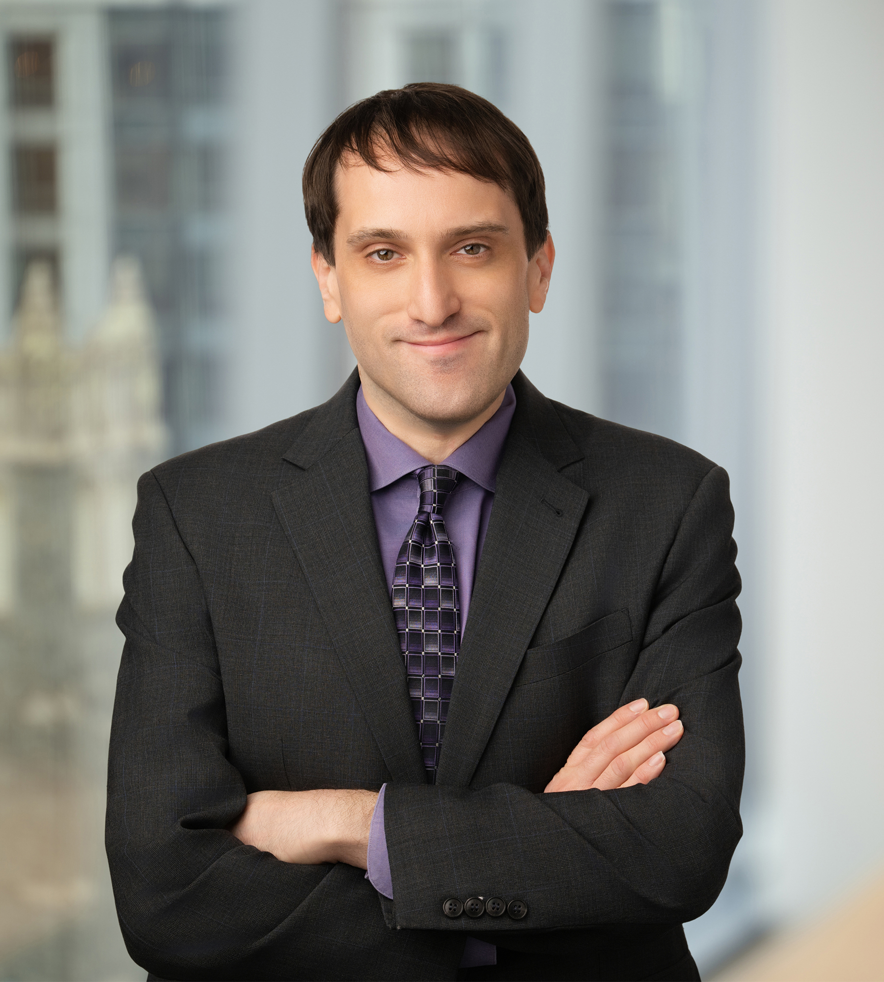 Photo of Matt Pearl standing in an office